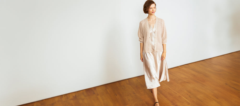 Woman wearing the Darya Double V Neck Dress and Beach Cardigan by Margaret O'Leary.