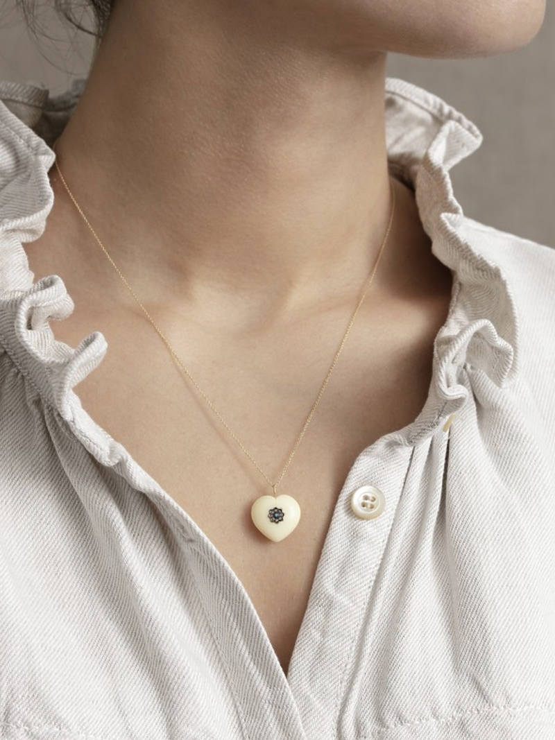 14 karat gold chain and pendant in vermeil and vegetal ivory set with diamonds and turquoise.