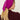 Woman wearing a Cashmere Triangle Scarf by Margaret O'Leary, a magenta headscarf on a plain background.