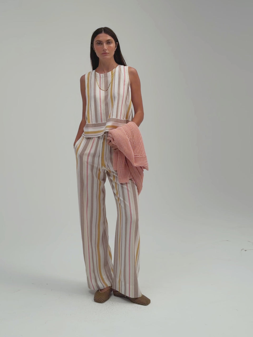 Avery Button Back Tank by Margaret O’Leary, sleeveless knit tank with button-back detail.
Vida Pant by Margaret O’Leary, wide-leg pant with relaxed fit and soft drape.
