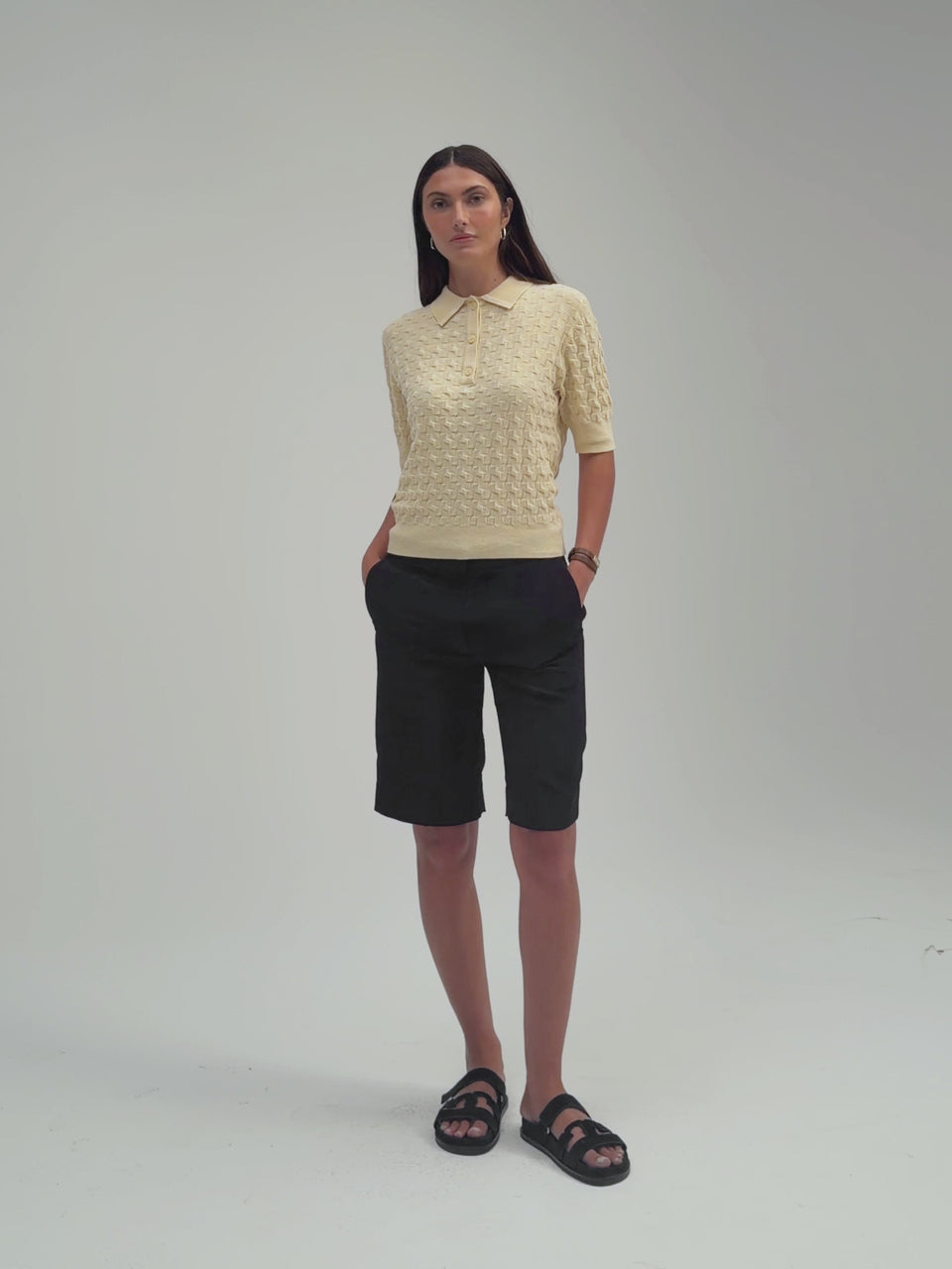 3D Polo by Margaret O’Leary, textured knit polo sweater with relaxed fit and collared neckline.