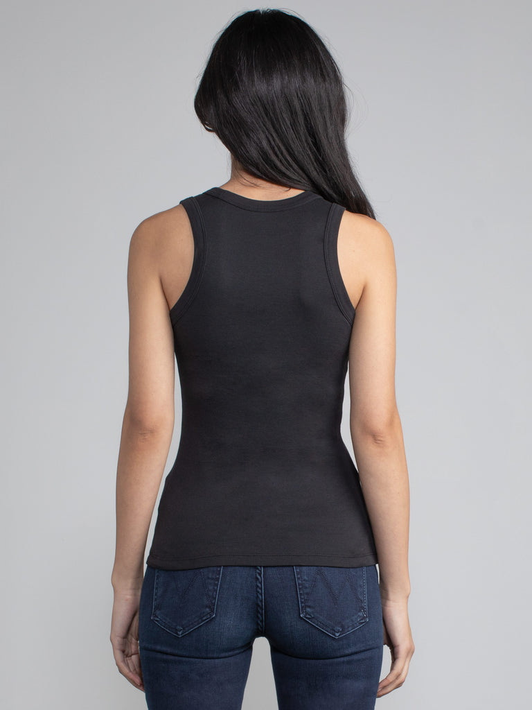 Back view of a woman wearing a fitted ribbed black tank.