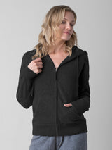 Model wearing a black color cashmere hoodie and a pair of the grey joggers.
