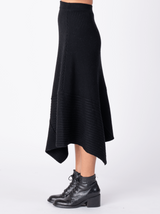 Side view of the black knit skirt.