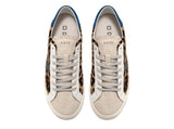 Low-top sneakers in brown animal print pony hair with a white suede tongue. 