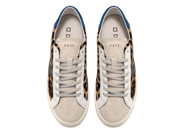 Low-top sneakers in brown animal print pony hair with a white suede tongue. 