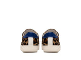 Back view: Blue and white leather details contrasting against the leopard print pony hair.