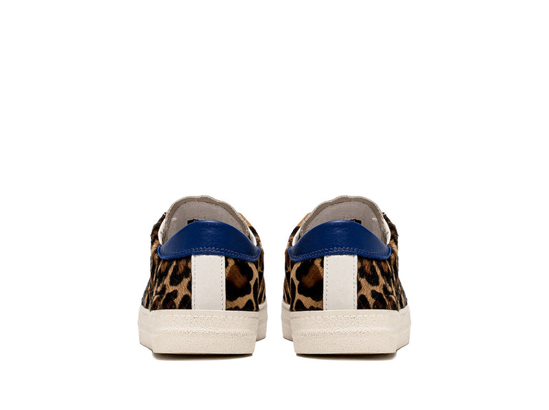 Back view: Blue and white leather details contrasting against the leopard print pony hair.