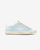 A distressed denim lowtop sneaker, set against a bright white background.