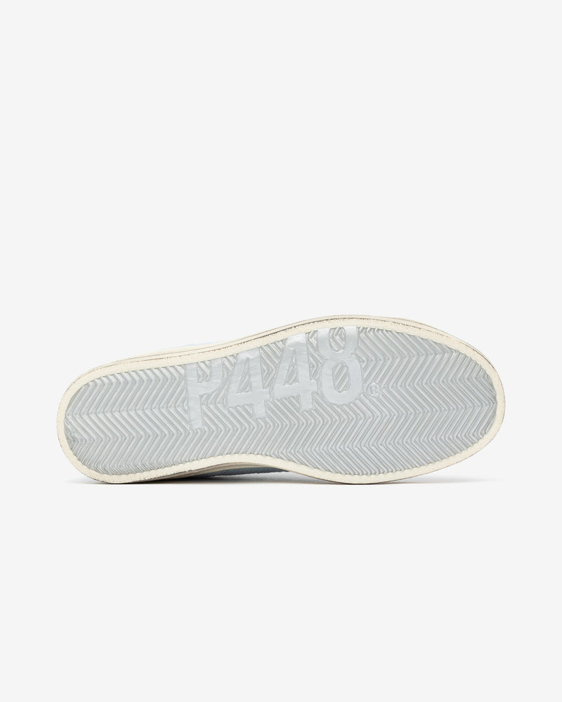 A view of the bottom sole of the John Denim sneaker, set against a bright white background.