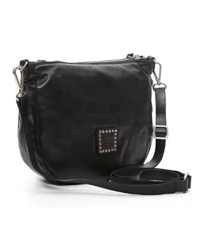 Black leather bag made with piece-dyed natural cowhide, laser-etched and ornate stud detailing and a removable/adjustable leather strap.
