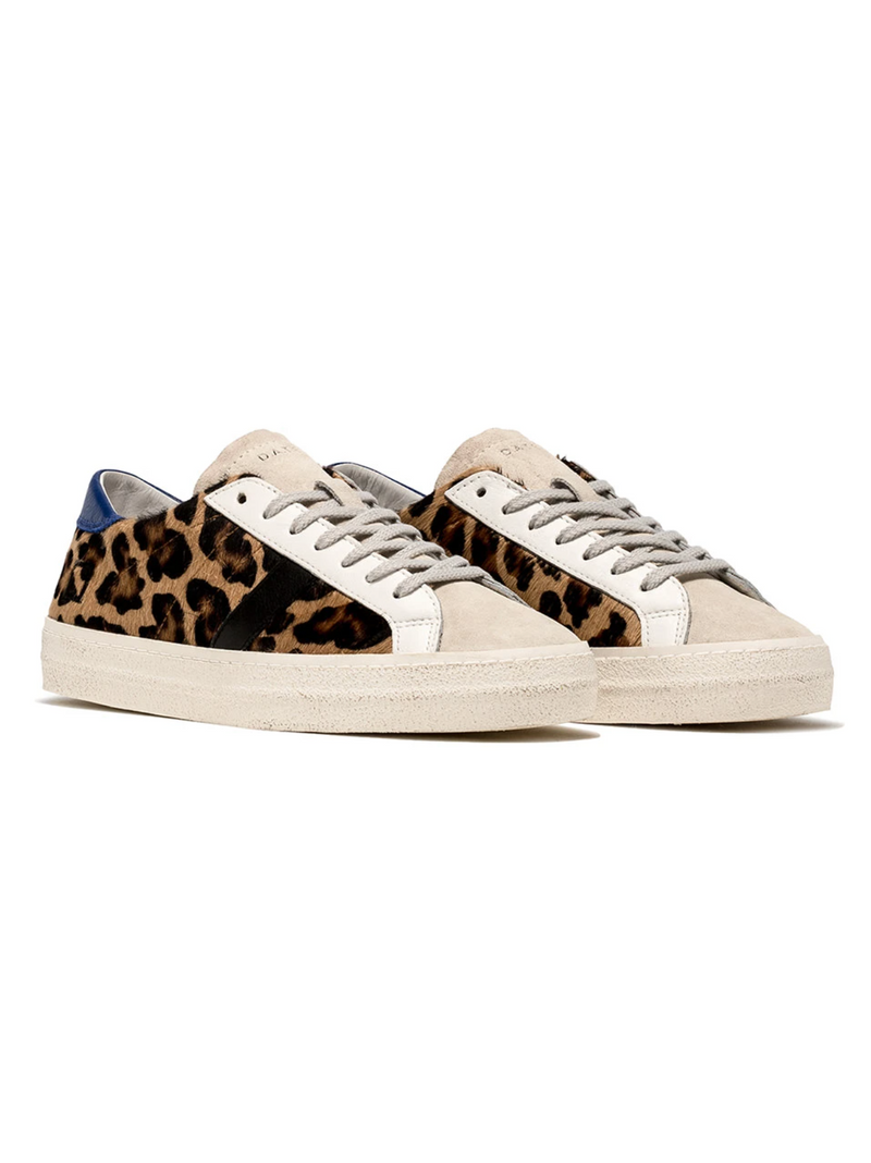 Low-top sneakers in brown animal print pony hair with a white suede tongue. 