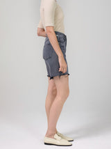 Side view of the grey denim shorts.