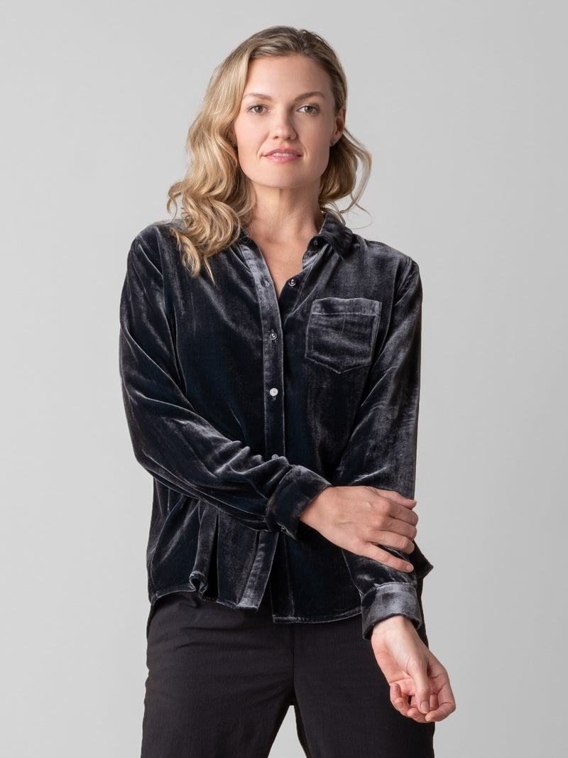 Model wearing a Dark grey velvet shirt and a pair of pants.